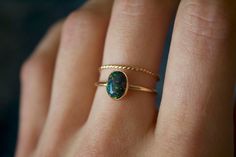 Handmade 8x6mm oval black opal ring✨  * Listing covers both the opal ring and twisted band. Dainty and perfect minimalist piece!  Stunning 8x6mm lab grown Kyocera opal gemstones. Each stone is hand set into a bezel and polished for a beautiful shine finish.   Opal means jewel. The energies of this stone will also encourage you to express your true self, in addition to feeling confident and comfortable in your own skin, and this will radiate in your words, thoughts, and actions. * Please note photos are zoomed in up close, therefore the size of the stone may appear slightly larger in photos. Model is wearing a size US 5.5. Please refer to stone measurement to best determine the size & look you're looking for.  Material: 14/20 (karat/purity) gold filled metal OR 925 Sterling silver / 935 arg Dainty Handmade Oval Opal Ring, Black Oval Opal Jewelry, Oval Black Opal Jewelry, Black Opal Jewelry, Opal Solitaire Ring, Black Opal Ring, Opal Ring Gold, Twisted Band, Feeling Confident