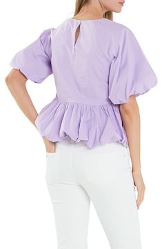 Delightful puff sleeves frame this charming peplum top crafted from crisp poplin. Jewel neck Short sleeves Cotton lining 100% cotton Hand wash, dry flat Imported Spring Cotton Puff Sleeve Top For Workwear, Cotton Puff Sleeve Top With Ruffle Hem For Spring, Chic Cotton Peplum Top, Cotton Puff Sleeve Top With Ruffles For Day Out, Cotton Top With Ruffle Hem For Daywear, Spring Cotton Puff Sleeve Top With Short Sleeves, Spring Cotton Top With Gathered Sleeves, Cotton Ruffled Short Sleeve Peplum Top, Spring Cotton Tops With Gathered Sleeves