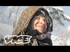 a woman wearing a hoodie and scarf in the snow