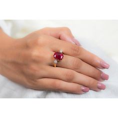 This is part of Chairish’s Fine Jewelry assortment.  Oval Cut Ruby Cocktail ring in 18K Gold which perfectly goes with your personality and also helps you to improve your energy and sensuality. Designed with big oval cut ruby in center and halo of clustered diamonds both side that makes it a perfect fit to wear it on your wedding or style it with any of your basic outfit to give it a glam.  PRODUCT DETAILS :-  > Material - 18K Solid Yellow Gold > Gemstone - Ruby > Gemstone Weight - 2.92 ct > Gemstone pcs - 1  > Gemstone shape - Oval  > Gemstone size - 12 x 9 mm > Diamond weight - 0.25 ct > Diamond Size - 1.5 mm > Diamond pcs - 14  > Gross Weight - 5.494 Grm > Shank width - 2 mm > Setting - Pinion Bezel setting Gia Certified Ruby Ring, Red Oval Sapphire Ring With Brilliant Cut, Elegant Gia Certified Ruby Ring, Luxury Oval Ring For Valentine's Day, Luxury Oval Rings For Valentine's Day, Oval Ruby Ring Fine Jewelry, Lab-created Ruby Ring With Brilliant Cut In Oval Shape, Gia Certified Oval Ruby Ring Gift, Gia Certified Red Ruby Promise Ring