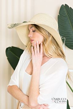 Take your vacay or weekend getaway up a notch with our Palm Beach Floppy Sun Hat! Look effortlessly sophisticated with this stunning sun hat that is composed of woven straw that shapes a high crown, a rounded top, and a wide, floppy brim (that can be shaped any way you wanna wear it!) with a knotted bow accent at the band. 6" brim. 22.5" interior circumference with an adjustable internal drawstring. Crown measures 4" tall 100% Paper Spot Clean Hand Made / Hand Printed Imported Chic Lightweight Straw Hat For Vacation, Lightweight Chic Straw Hat For Vacation, Chic Straw Sun Hat For The Beach, Chic Straw Sun Hat For Beach, Chic Woven Sun Hat For Vacation, Woven Straw Sun Hat For Summer, Beachwear Sun Hat For Vacation, Summer Travel Sun Hat Made Of Toquilla Straw, Summer Coastal Straw Hat