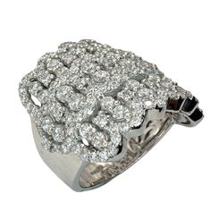 a white gold ring with diamonds on the sides and an oval design in the middle