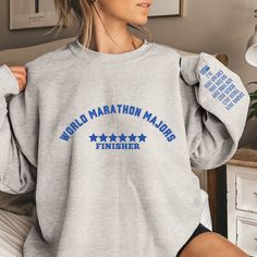 World Marathon Majors Finisher Sweatshirt, Personalized Running Sweatshirt, Custom Marathoner Sweatshirt, Marathon Runner Shirt, 6 Stars Congratulations Marathon Finisher and Half Marathon Finisher! Celebrate your accomplishment with this Personalized Marathon Finisher Sweatshirt.  This lightweight cotton will keep you comfy even in the warmer months.  It's made of super soft cotton and has a quality of the print will have you falling in love with it over and over again. It is sure to be one of your favorite most comfortable Shirt. 💜 Description 💜 This Shirt is sure to be one of your favorites! It can be styled with shorts or leggings for any distance run while remaining stylish and comfortable.  💜 When you order your Shirt you will get: 💜  *Super Comfortable Shirt, which comes in a va Marathon Runner, Marathon Runners, Half Marathon, San Jose Ca, San Jose, Falling In Love, Cool Designs, Shirt Designs, Tops Designs