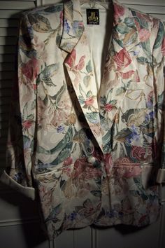 "Floral spring jacket by Sam Moire.  Bust measures 42\", length 29\".  Fabric is poly and rayon.  Looks like linen and silk.  No flaws of any kind.  Stored with TLC.  Comes from a smoke-free home." Vintage Summer Blazer For Formal Occasions, Silk Blazer With Notch Lapel For Spring, Summer Vintage Formal Blazer, Summer Silk Formal Outerwear, Vintage Summer Formal Blazer, Silk Long Sleeve Summer Outerwear, Spring Silk Single Breasted Blazer, Vintage Cream Blazer For Spring, Vintage Beige Blazer For Spring