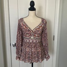 Angie Floral Boho Tunic Top. Puffed Sleeves With A Cutout Center And Smocked Back. Size Small, Too Measures Approximately 14” Armpit To Armpit And Approximately 21” In Length. Never Worn. Bohemian V-neck Top With Smocked Back, Bohemian V-neck Tops With Smocked Back, Bohemian V-neck Blouse With Smocked Back, Bohemian Long Sleeve Blouse With Smocked Back, Bohemian Blouse With Smocked Back And Long Sleeves, Bohemian Long Sleeve Top With Smocked Back, Bohemian Flowy Smocked Top For Fall, Flowy Bohemian Smocked Top For Fall, Bohemian Flowy Peasant Top With Smocked Back