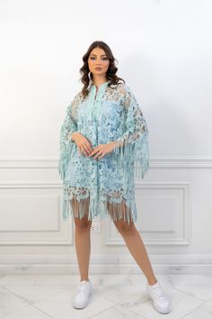 (SALE ITEM - FINAL SALE)Featuring: Floral Lace Fringe sleeves Unlined Bell sleeves Band collar Color: Tiffany blue.Brand: Unmatched BYU.Match it with a slip dress - The model is wearing a baby blue mini slip dress (Shop slip dresses)Size: Free Size. "fits sizes between 2 (US) up to 24 (US)"Exact Caftan Measurements: Bust: 52 (Inches)Hem: 63 (Inches)Length: 32.5 (Inches)This caftan is available in multiple colors Light Blue Long Dresses For Spring, Long Light Blue Spring Dress, Bohemian Long Sleeve Sheer Dress, Long Evening Kaftan For Spring, Long Kaftan For Spring Evening, Long Kaftan For Evening In Spring, Long Kaftan For Evening And Spring, Summer Long Sleeve Kaftan For Parties, Long Sleeve Spring Kaftan With Tassels