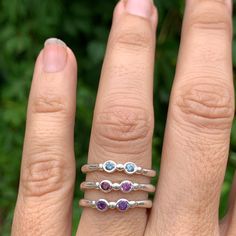 Wear them on their own or stacked all the way up your finger, our gemstone stacking bands in reclaimed sterling silver are the perfect addition to your daily jewels, a perfect gift for a loved one or yourself. Available in Ruby, Rhodolite Garnet, London Blue Topaz, Peridot, Amethyst, Blue Zircon, Spessartite Garnet, and Moonstone and mixed (pick your own stones) Each Stone measures approx 2.5mm. These beautiful pieces are handmade to order in Emily's Hudson Valley studio. Please allow 14-21 busi