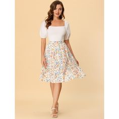 Made of floral-printed fabric, this midi skirt is high-waisted featuring an A-line silhouette. This flowy midi skirt with a tiered design and vintage allover floral prints. Featuring an A-line and tiered details, it is a summer casual skirt to be paired well with a top and sandals for a cute day look and with a stylish T-shirt and vintage high heels for a charming inspired look. Spring Floral Print Full Maxi Skirt, Floral Print Relaxed Midi Skirt, Knee-length Floral Print Skirt For Garden Party, Garden Party Midi Skirt With Floral Print, Floral Print Dress With Voluminous Flared Skirt, Floral Print Midi Skirt For Garden Party, Feminine Flared Skirt With Floral Print, Flowy Floral Print Maxi Skirt, Spring Floral Print Flared Skirt