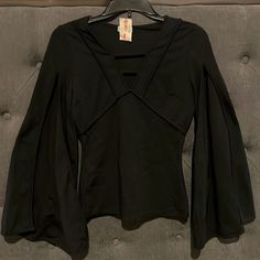 Size Medium, Stretchy. Outer Shell Material; 65%Rayon, 30%Nylon, 5%Spandex Spring Party Blouse In Elastane, Edgy Black Stretch Blouse, Fitted Elastane Blouse For Night Out, Black Elastane Top For Party, Elastane V-neck Top For Parties, Stretch Long Sleeve Tops For Going Out, Edgy Stretch Blouse For Night Out, Black Tops For Going Out In Spring, Edgy Tops For Going Out In Spring