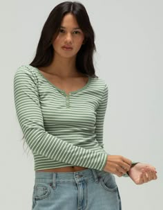 Rsq Striped Long Sleeve Henley. This Stripe Long Sleeve Henley Combines Casual Comfort With Classic Style. Featuring A Buttoned Henley Neckline And A Timeless Striped Pattern, It Offers A Flattering Fit That's Perfect For Everyday Wear. Made From Soft, Breathable Fabric, This Top Is Ideal For Layering Or Wearing On Its Own, Adding A Touch Of Laid-Back Charm To Any Outfit.66% Rayon, 29% Polyester, 5% Spandex. Hand Wash. Imported. Model Is Wearing A Size Small. Model Measurements:height: 5'7" Bust Summer Tops Women With Sleeves, Striped Longsleeves Outfit, Women Henley Shirt Outfit, Patterned Long Sleeve Shirt, Aesthetic Long Sleeve Shirts, Long Sleeve Button Up, Cute Tops Long Sleeve, Long Sleeve Summer Tops, Long Sleeve Shirts Aesthetic