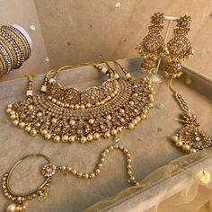 an assortment of gold jewelry on display