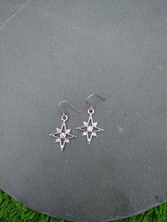 PLEASE read my shop announcement before placing an order so you know what to expect right now. Plus, when ordering from outside Europe, don't forget to provide a phone number for the courier to ensure the fastest and smoothest delivery. Elegant dangle rhinestone starburst earrings, comfortable and lightweight Stainless steel earhooks Stainless steel hooks, won't rust, change its tone or cause you any allergies More Magical celestial jewelry here: https://www.etsy.com/shop/ValkyriesSong?ref=selle Silver Stainless Steel Jewelry With Star Charm, Celestial Silver Earrings With Star Charm, Silver Star Charm Earrings In Stainless Steel, Silver Stainless Steel Star Charm Earrings, Silver Stainless Steel Earrings With Star Charm, Star Charm Metal Drop Earrings, Metal Star Charm Drop Earrings, Silver Starburst Celestial Earrings, Single Star-shaped Crystal Earring As Gift