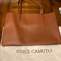 New Vince Camuto Chic Dark Tan Shoulder Bag For Everyday, Chic Caramel Shoulder Bag For Travel, Chic Caramel Shoulder Bag For Shopping, Chic Dark Tan Soft Leather Shoulder Bag, Chic Camel Satchel For Shopping, Casual Cognac Satchel For Daily Use, Chic Dark Tan Shoulder Bag For Shopping, Chic Cognac Satchel For On-the-go, Chic Dark Tan Shopping Bags