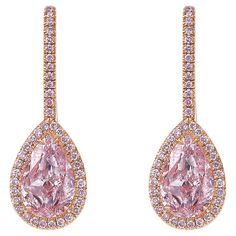 2.02 and 2.22 Carat Center Diamonds Light Pink Pear Shapes VS1 and VS2 0.42 Carats of Surrounding Pink Diamonds Excellent + Very Good cutting Set in 18k White Gold with 14k Rose Gold plating GIA Certified Diamonds Handmade in NYC This piece can be viewed before purchase in our showroom in NYC, or at one of our retail partners throughout the country, please inquire for more info. Appraisals can be done on all purchases. We use the best jewelers in New York and can redesign any piece to your likin Pink Pear Diamond, Pear Shapes, Pink Diamonds, Diamond Drops, Pear Diamond, Jewelry Diamond, Fancy Color Diamonds, Diamond Drop Earrings, Pink Diamond