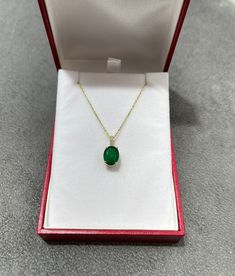 Featured here is a stunning oval emerald & diamond accent necklace in fine 18k yellow gold. Displayed in the center is a deep green emerald accented by a simple four-prong gold mount, allowing for the emerald to be shown in full view. Diamonds accent the bale of the pendant. The earth mined, green emerald has a desirable lush green color with excellent qualities. The chain is sold separately. Total Carat Weight: 2.82cts Setting Style: Four Prong Setting Material: 18k Yellow Gold Main Stone: Elegant Oval 14k Stamped Necklace, Classic Gold Emerald Oval Pendant Necklace, Classic Gold Emerald Necklace With Oval Pendant, Luxury Oval Emerald Necklace Gift, Luxury Green Oval Necklace, Luxury Oval Necklace With Prong Setting, Elegant Oval Emerald Necklace In Yellow Gold, Green Oval Necklace For Formal Occasions, Formal Green Oval Necklace