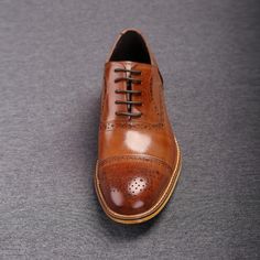 Brown Oxford shoes are life-savers of a sort because they can be worn with almost anything! Since these are high-quality ones, you can rest assured they will go equally well with jeans and tweed. This pair will be a great addition to any unique shoe collection. These oxfords can be worn with 2- and 3-piece business suits and casual suits, whatever suits your taste! Suits with bold patterns and material blends will also be perfect with these shoes. No matter which color suit you are wearing, these shoes go along with every shade. Be it grey, dark brown, or navy colored suits. In fact, many style experts prefer them over wearing black due to their far more visually striking effect. The shoes are constructed from 100% Genuine Leather for maximum durability The only premium quality leather is Leather Wingtip Oxfords For Fall, Classic Wingtip Lace-up Shoes For Fall, Leather Cap Toe Oxfords For Fall, Goodyear Welted Oxfords For Fall With Round Toe, Fall Goodyear Welted Oxfords With Round Toe, Fall Season Brogue Oxford Leather Shoes, Fall Oxfords With Goodyear Welted Round Toe, Fall Oxfords With Goodyear Welt And Round Toe, Fall Business Wingtip Lace-up Shoes