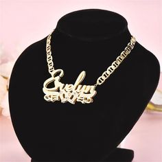 Elevate your jewelry collection with our exquisite Real 18K Gold Filled Stainless Steel Name Necklace. Crafted with care and attention to detail, this necklace is the perfect personalized accessory to showcase your individuality and style. Featuring a durable stainless steel base that is expertly plated with real 18K gold, this necklace offers a luxurious and timeless appeal. The gold filling ensures a lasting shine and luster, making it a jewelry piece that can be cherished for years to come. The centerpiece of this necklace is the birthstone nameplate, adding a touch of elegance and personalization. Each nameplate is meticulously crafted to showcase your chosen name, making it a truly unique and meaningful gift for yourself or a loved one. Not only does this necklace boast exceptional be Luxury Rose Gold Nameplate Jewelry, Affordable Nameplate Necklace With Letter Print, Luxury Nameplate Fine Jewelry, Luxury Nameplate Jewelry, Luxury Diamond Nameplate Necklace Gift, Intertwined Hearts, Name Plate Necklace, 3d Name, Pink Zircon