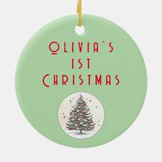 a christmas tree ornament with the words, ollivia's 1st christmas