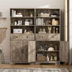 a large wooden bookcase with doors and drawers in the middle of a living room