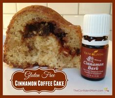 the cinnamon coffee cake has been cut in half and is next to an essential oil bottle