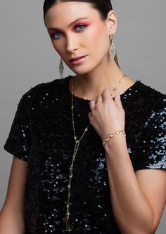 Wrap yourself in sparkle with the LONDON lariat necklace. This versatile necklace will be your go to necklace this season, and can be worn in a variety of ways. Layer it up or wear it in the back — the options are endless. Available in a bright silver or trendy gold, this multi-functional lariat necklace is perfect for any occasion. The necklace is completed with metal tassels at the end to a bit of drama and measures to 36 inches in length allowing you to style it in a variety of ways. Pink Emerald, Black Tie Affair, Black Hot Pink, Lariat Necklace, Diamond Crystal, Luxury Accessories, Crystal Bracelets, Gold And Silver, Black Tie