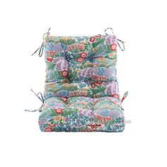 an outdoor chair cushion with colorful flowers on the front and back, tied up to it's sides