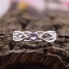 "Celtic style 925 sterling silver womens amethyst promise ring, Unique dainty & elegant promise ring for her, Celtic amethyst engagement ring WE OFFER UNLIMITED PERIOD INSTALLMENTS PLAN This is a beautiful, stunning, feminine ring that works well for all occasions, styles, and ages. You will love it! Ring information Stone: Amethyst Approximate size: 3.5mm Metal type: Silver Metal stamp: 925 Sterling SIlver Customization / Replacements It's easy to create jewelry that's perfect for you. Chan Dainty Purple Promise Ring Jewelry, Sterling Silver Amethyst Ring With Prong Setting For Promise, Purple Sterling Silver Promise Ring, Promise Amethyst Ring With Prong Setting In Silver, Silver Adjustable Amethyst Promise Ring, Purple Sterling Silver Birthstone Ring With Round Band, Adjustable Silver Amethyst Promise Ring, Silver Amethyst Ring In 14k White Gold, Silver Amethyst Birthstone Ring In Dainty Style