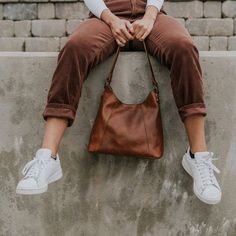 Our leather purses for women bring handmade fashion to practical function — like this beautiful soft brown leather shoulder bag. The clean vintage style makes this purse a beautifully simple addition to any outfit for any woman. Classic Leather Hobo Bag With Brass Hardware, Summer Tops Women Casual, Buffalo Jackson, Sewing Photography, Cross Body Satchel, Vintage Leather Backpack, Photography Bags, Simple Summer Outfits, Shooting Ideas