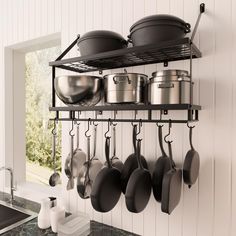 pots and pans are hanging on the wall