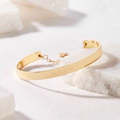 Preserve a special day forever with the Gwen Date Cuff Bracelet. Personalize your cuff with your choice of dates and choose between rose gold, yellow gold, or rhodium plating options for a completely unique piece. A lovely gift for graduations, engagements, anniversaries, and birthdays! Available in 14k gold plated, rhodium plated or 14k rose gold plated brass Width: 1/4" Length: 5 1/2" Made in the USA With engraving this item is FINAL SALE SKU: BYB1034 Modern Engraved Rose Gold Bracelets, Engraved Rose Gold Cuff Bangle Bracelet, Engraved Rose Gold Bangle Cuff Bracelet, Engraved Rose Gold Cuff Bangle, Adjustable Luxury Rose Gold Cuff Bracelet, Luxury Adjustable Rose Gold Cuff Bracelet, Adjustable Gold Bangle Bracelet For Anniversary, Elegant Engraved Cuff Bracelet For Personalized Gift, Elegant Engraved Cuff Bracelet As Personalized Gift