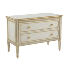 a white and gold dresser with two drawers