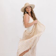 The sarong is the best accessory for your days at the pool or beach. And takes up zero room in your suitcase when you're packing for your beach vacation! Breezy, comfortable, and versatile our Ivory Coast Sarong can be worn tied around the waist or even tied around the neck as a dress. Block Printing is one of the oldest types of printmaking, and has been around for thousands of years. Our Block Printed Sarongs have bright bold prints and are stamped onto a super soft cotton. Perfect for an easy Beachy Wrap Sarong For Beach Cover-up, White Sarong For Summer Beach Cover-up, Beachy Sarong For Vacation, White Summer Swimwear For Warm Weather, White Wrap Swimwear For Beach Season, Summer Sarong For Beach Cover-up, Beachy White Sarong For Vacation, Beachy Tie-side Sarong For The Beach, Bohemian Tie-side Sarong For Vacation