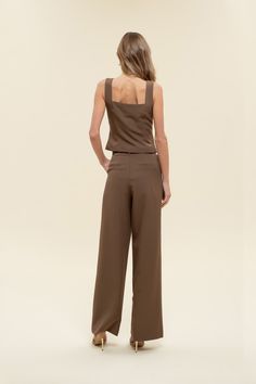 Office chic to date night to weekends looking cutie while on-the go, dress to impress in our Greenwich pleat trousers. These high-waisted pants feature a hook and eye closure, belt loops, back pockets, slick side pockets, pleated detailing, a wide leg with a flared hemline, and let's not forget they are the color of the season - chocolate BROWN! Designed in the USA. Imported Fabric Content: 88% Polyester, 12% Spandex. Inner Lining: 100% Polyester Model is 5'6 and is wearing a size Small. Belted High Waist Bottoms For Date Night, Chic Tailored Wide Leg Pants For Business Casual, Belted Bottoms For Date Night, Elegant Belted Solid Wide Leg Pants, Elegant Solid Color Belted Wide Leg Pants, Chic Leather Pants For Business Casual, Chic Belted High-waisted Wide Leg Pants, Chic Belted Bottoms For Date Night, Solid Belted Wide Leg Pants For Work