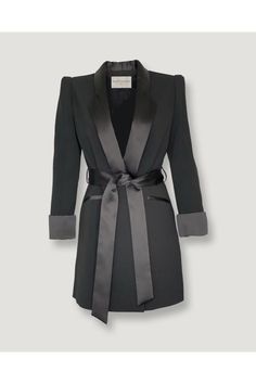 Belted Evening Robe Blazer.brThis blazer with its cool 3/4 rolled contrast sleeves and a long silhouette is the perfect tailored look. Black satin contrast lapels, belt, side pockets, and sleeves. Structured shoulder.brGreat to wear with skinny black satin pant and a spaghetti straps silky lace camisole for an evening look. This blazer can also be worn over the shoulder as a layering piece over an evening gown.brMid-length.brContent: 88% Polyester, 8% Viscose, 4%ElastinebrMADE IN ITALYbrDry Clea Sleek Black Blazer Dress With Suit Collar, Sleek Black Single-breasted Blazer Dress, Sleek Black Semi-formal Blazer Dress, Sleek Lapel Collar Blazer Dress For Party, Sleek Blazer Dress With Lapel Collar For Party, Luxury Black Blazer Dress For Semi-formal Occasions, Luxury Black Blazer Dress For Semi-formal Events, Semi-formal Black Blazer Dress With Hidden Button Closure, Luxury Formal Blazer With Belted Cuffs