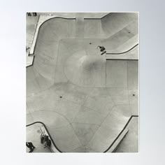 black and white photograph of skateboarders at a skate park poster print on the wall