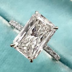 an engagement ring with a princess cut diamond