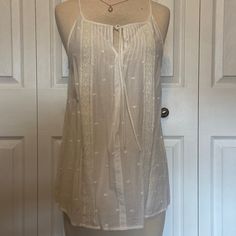 Nwot. Purchased But Never Worn. Very Dainty And Delicate Looking. Boho Look. Color Is Listed As White But This Is More Off White/ Ecru Color Cream Cami Tank Top For Beach, Cream Cami Tank Top For The Beach, Cream Camisole Top For Beach, Cream Tank Top For Summer Daywear, Cotton Cami Tank Top For Daytime, Cream Sleeveless Daytime Top, Cream Sleeveless Top For Daytime, Casual Cream Camisole For The Beach, Feminine Camisole For Beach