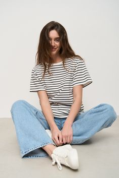 The loose-fit striped T-Shirt is a very versatile item that can be used for different seasons and clothing styles. It can be combined with jeans, shorts, skirts, as well as with flat shoes or sneakers. Summer Streetwear T-shirt With Contrast Stripes, Summer Short Sleeve T-shirt With Striped Hem, Trendy White T-shirt With Contrast Stripes, Casual Cotton Tops With Vertical Stripes, Trendy Relaxed Fit T-shirt With Contrast Stripes, Casual Short Sleeve T-shirt With Vertical Stripes, Casual Cotton Top With Horizontal Stripes, Casual Horizontal Stripe Pattern T-shirt For Everyday, Casual Summer Tops With Horizontal Stripes