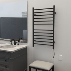 a bathroom with a sink, mirror and towel rack