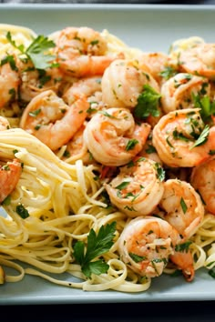 pasta with shrimp and parsley on top