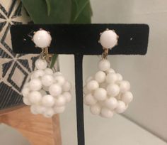 "This listing features a pair of Vintage White Earrings White beads form a sphere that drops from a single white bead An adorable pair of drop earrings for summer or boho wedding Closures are clip-on Condition is good with a few old glue signs Signed Hong Kong on clasp Size is 1 3/4\" L x 1\" W Come in new gift box Thank you" Pom Pom Drop, Earrings For Summer, Earrings White, White Earrings, Earrings Boho, White Beads, Boho Wedding, White Vintage, Hong Kong