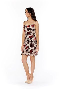 Velvet floral detail mini dress with adjustable shoulder straps, tie back, and waist details