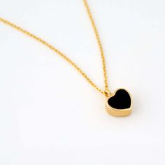 Presenting the Black Heart Necklace in 14K Solid Gold, an ideal birthday gift for women. This dainty heart necklace, crafted in 14k yellow gold, radiates luxury and elegance. With its unique heart design, this stylish necklace adds a touch of sophistication to any outfit, making it a must-have in your jewelry collection. Perfect for everyday wear or special occasions, it's not just a piece of jewelry, it's a symbol of love and affection. 14K solid gold handcrafted pieces 100% ethical sourced jew Luxury Heart-shaped Necklace With Delicate Chain, Elegant Double Heart Gold Plated Necklace, Formal Heart-shaped Necklaces With Delicate Chain, Delicate Heart Chain Necklace For Formal Occasions, Elegant Gold Plated Double Heart Necklace, Formal Heart-shaped Necklace With Delicate Chain, Formal Heart Pendant Necklace With Clavicle Chain, Chic Heart Charm Necklace As Gift, Formal Heart Necklace With Clavicle Chain