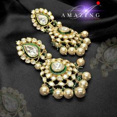 Moissanite and Swarovski Pearls with Green Enamel Earring | Indian Wedding Jewelry | Indian Moissanite Polki Earring| Statement Earring Material : Silver Gemstone: Moissanite, Swarovski, Green Enamel Stone colour: Uncut Polki Primary colour: Gold Size-Length: 85mm Width: 40mm Closure : Screw back and Clips Silver Intricate, hand crafted, Pure Silver Polki Earrings, studded with high quality Moissanite and Swarovski Pearls with Green Enamel Earring comes with screw back and clips, made in 92.5 si Elegant Kundan Bridal Earrings With Stone Work, Elegant Stone Work Bridal Earrings For Reception, Elegant Bridal Earrings With Stone Work In Cubic Zirconia, Elegant Bridal Earrings With Stone Work For Reception, Elegant Stone Work Earrings For Formal Occasions, Luxury Green Diamond Earrings For Wedding, Elegant Green Chandelier Earrings With Intricate Design, Elegant Kundan Bridal Earrings For Reception, Elegant Round Chandelier Earrings For Reception