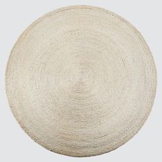 a white round rug on a gray background