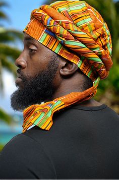 Imagining the vibrant colors of the African landscape, our uniquely crafted 100% cotton Kente Turban, affectionately named "Asase" after the Ghanaian earth goddess, is a true masterpiece by Dupsie's African Fashion. This pre-wrapped Turban in Orange, Green, Black, Off-White, Blue, and Burgundy African Print showcases the rich history and culture of African fashion, securing its place as a must-have accessory for men. The tradition of Turbans in African fashion dates back centuries, symbolizing n Fitted Multicolor Headwrap For The Beach, Multicolor Summer Turban, One Size Fits Most, Multicolor Turban Headband For Beach, Fitted Multicolor Headwrap With Matching Headband, Multicolor Casual Turban Headband, Casual Multicolor Turban Headband, Multicolor Turban With Matching Headband For Beach, Casual Multicolor Headband Turban, Traditional Adjustable Summer Turban