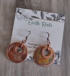 These boho style earrings feature 1" copper discs that have been firepainted using a propane torch. These earrings measure 2" in length. They will ship in a gift box or bag via USPS with tracking info provided. Brown Copper Hoop Earrings As Gift, Copper Brown Hoop Earrings As A Gift, Bohemian Copper Hoop Earrings As Gift, Brown Copper Hoop Earrings For Gift, Adjustable Rust Earrings With Ear Wire, Handmade Copper Hoop Earrings, Rustic Copper Earrings In Rust Color, Earthy Nickel-free Copper Jewelry, Bohemian Small Hoop Copper Earrings