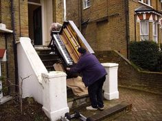 a woman is playing an organ on the steps