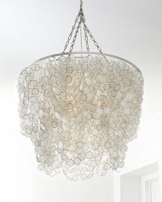 a white chandelier hanging from the ceiling