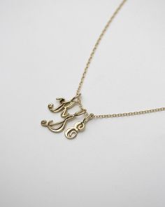 14k Gold Initial Pendant Charm Necklace With Delicate Chain, 14k Gold Initial Necklace With Delicate Chain For Anniversary, Dainty 14k Gold Initials Charm Necklace, Classic 14k Gold Initials Charm Necklace, Classic 14k Gold Initial Charm Necklaces, Minimalist 14k Gold Monogram Initial Necklace, 14k Gold Initial Necklace With Name, Gold Initial Pendant Necklace In 14k, Dainty 14k Gold Monogram Necklace